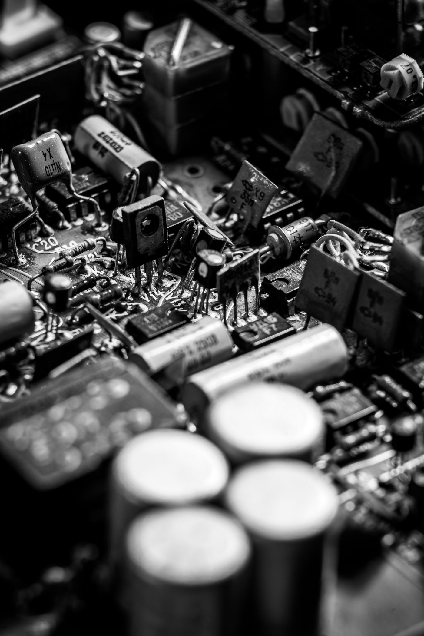 Close-up of capacitors and electronic components on a printed circuit board
