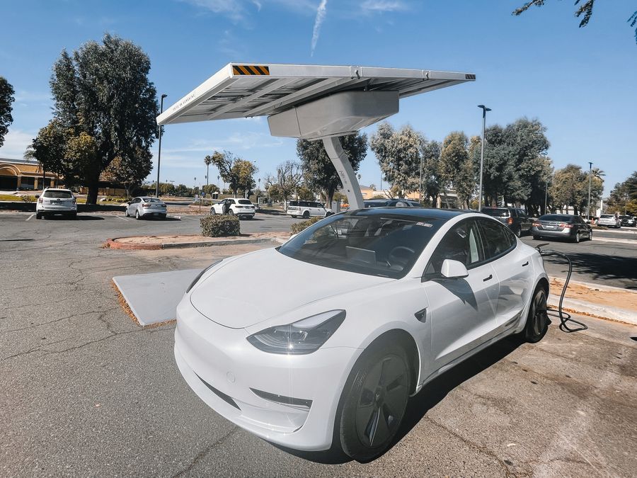 Electric vehicle charging at a solar-powered charging station